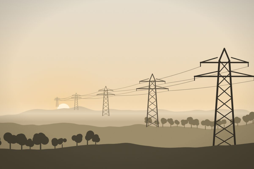 Electricity transmission towers crossing rolling hills at golden hour