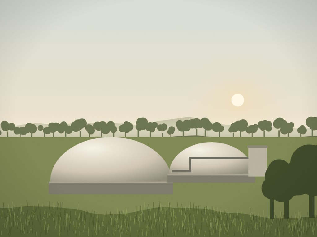 Biodigester domes set among green fields