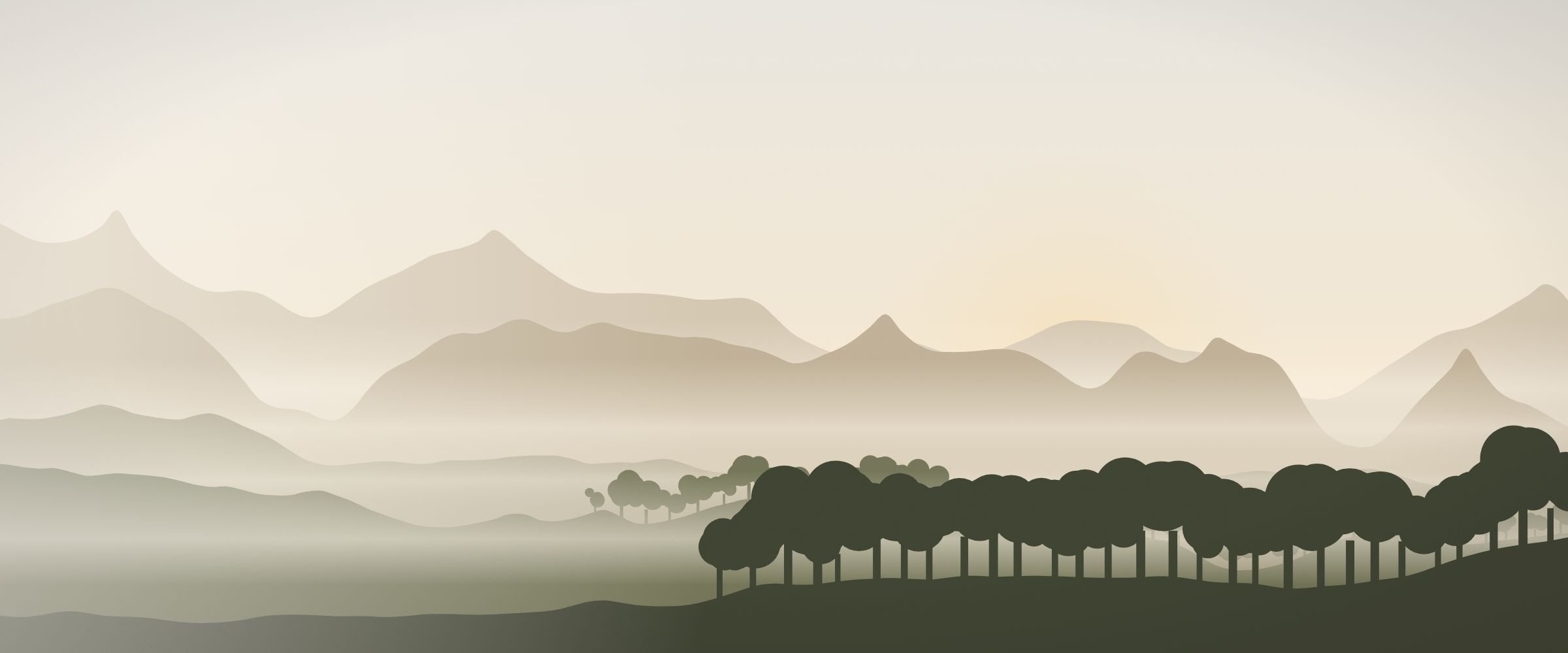 Layered mountain ridges in morning mist